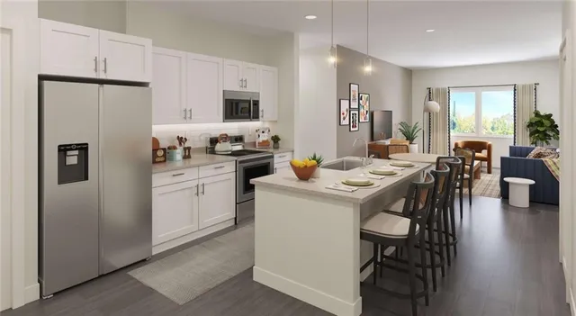 a kitchen that has a table and chairs in it