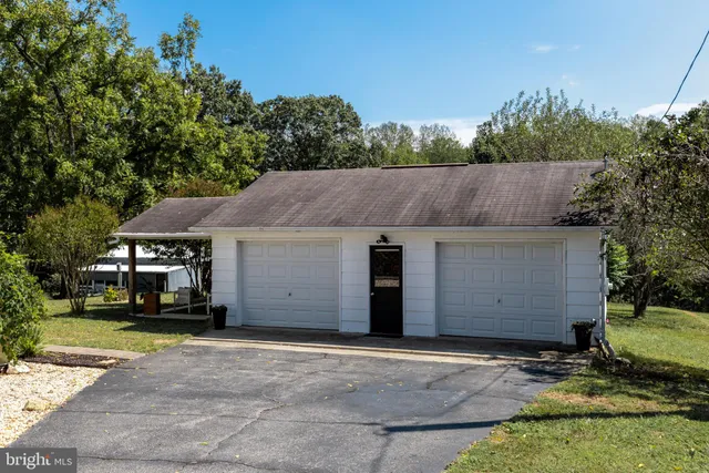 a view of a house with a yard and plants