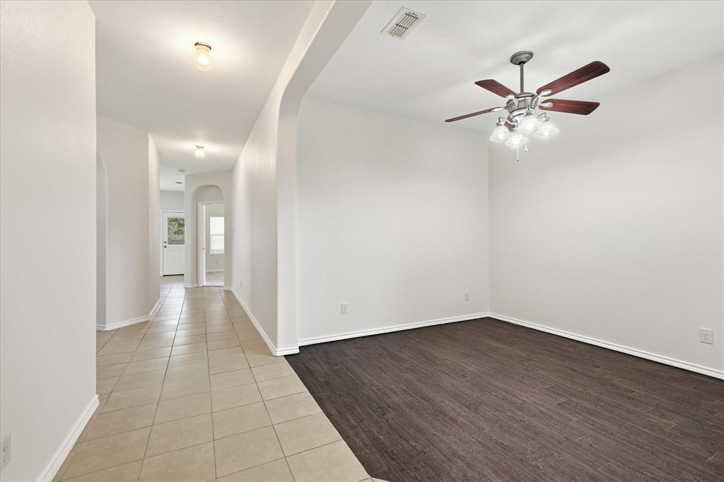 720 Rio Bravo Drive Fort Worth, TX 76052 - Photo 7 of 38 Entryway featuring neutral-toned tile flooring and arched doorways