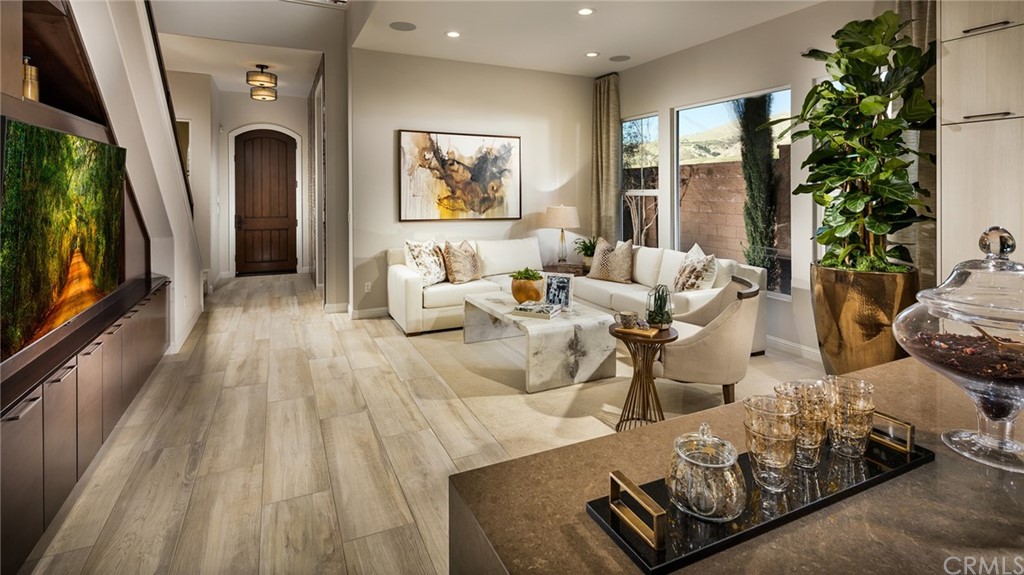 20740 Bur Oak Circle Porter Ranch, CA 91326 - Photo 2 of 10 a living room with furniture and a flat screen tv