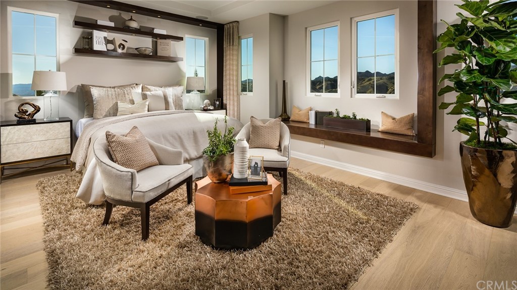 20740 Bur Oak Circle Porter Ranch, CA 91326 - Photo 7 of 10 a living room with furniture and a potted plant