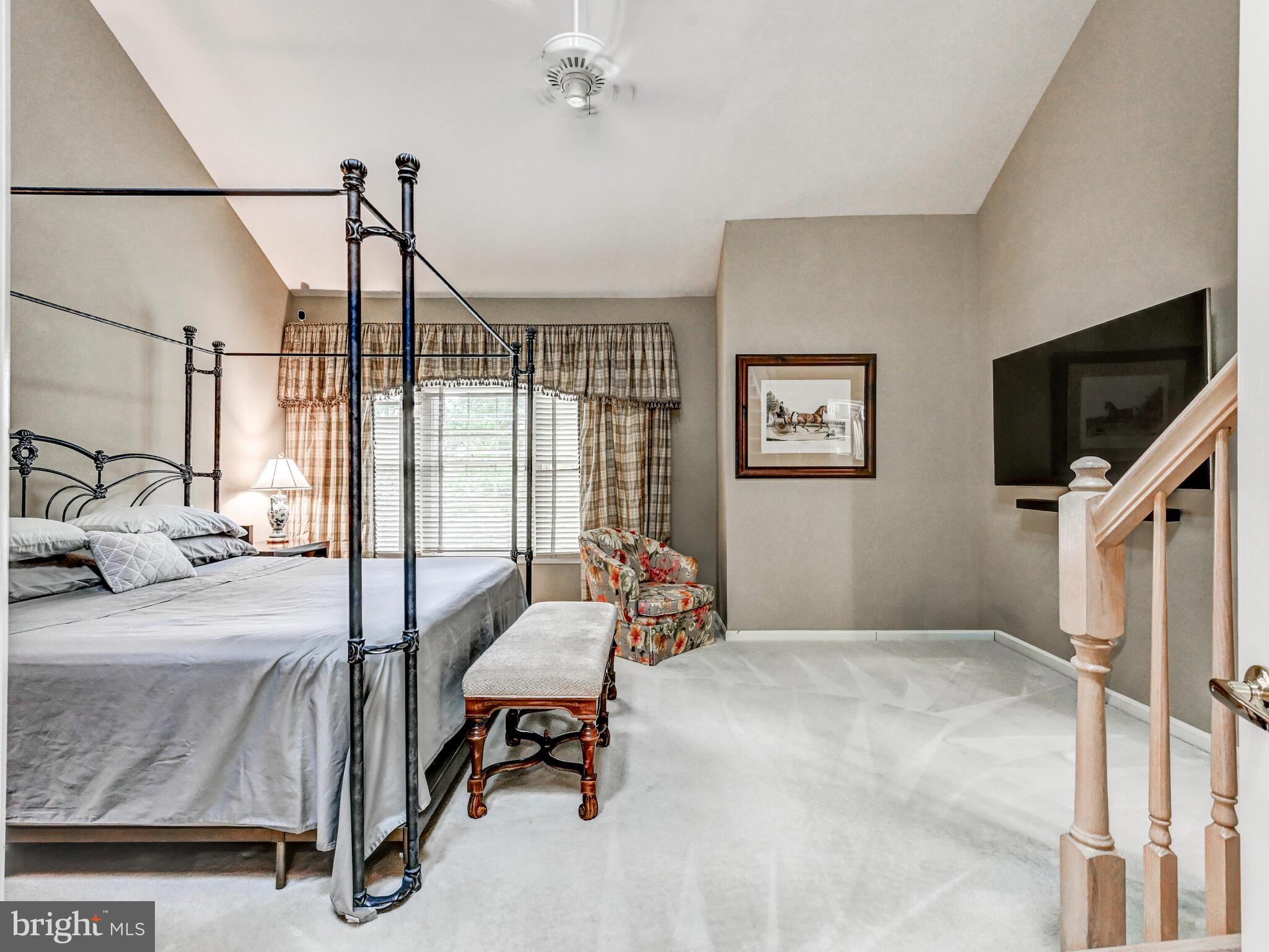 111 River Oaks Circle Baltimore, MD 21208 - Photo 17 of 35 a bedroom with furniture and a flat screen tv