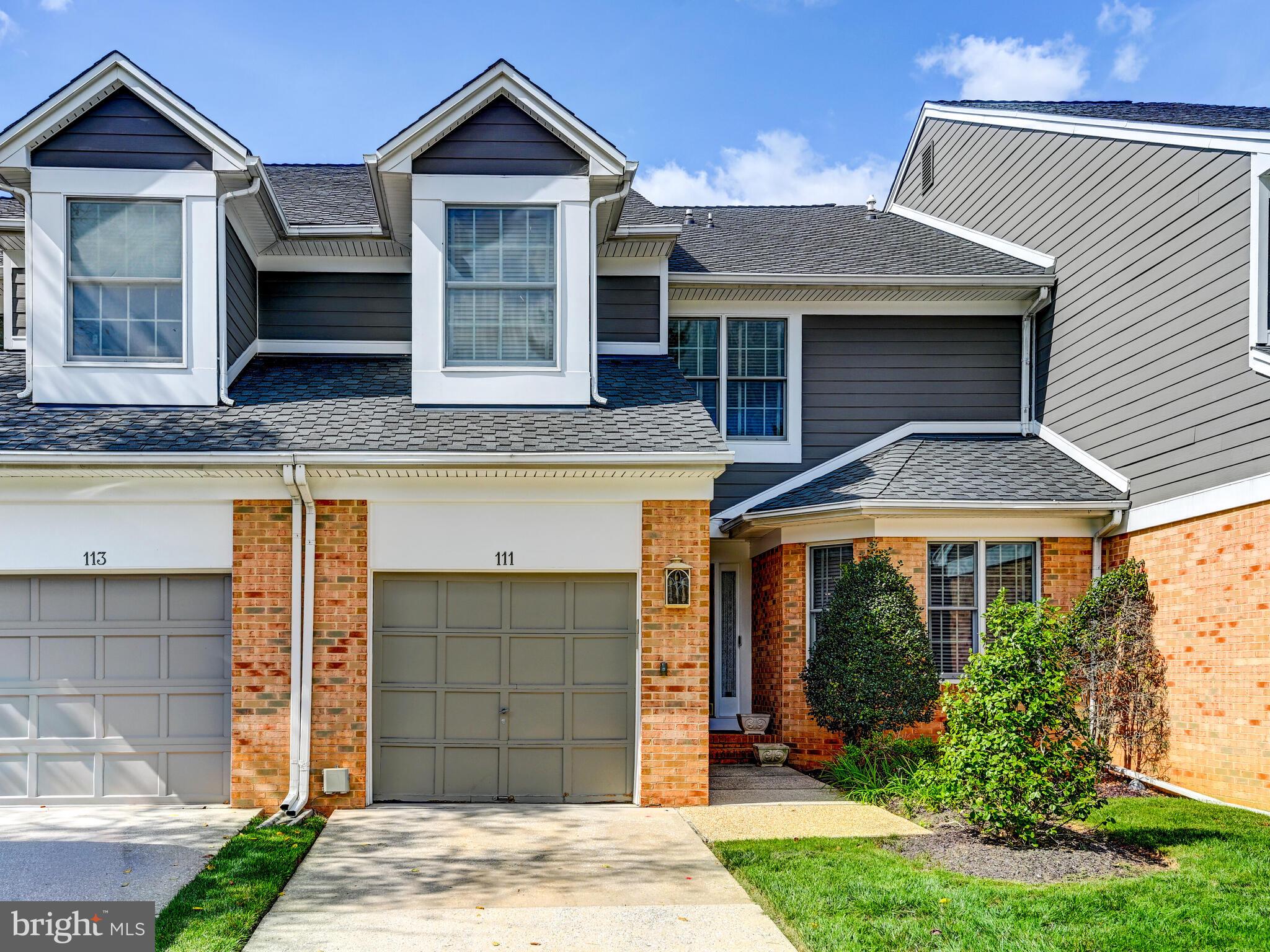 111 River Oaks Circle Baltimore, MD 21208 - Photo 2 of 35 a front view of a house with garden