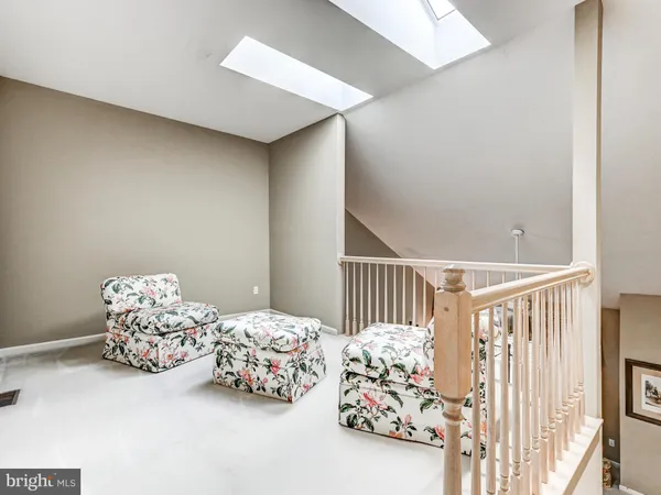 a bedroom with three beds and a baby crib