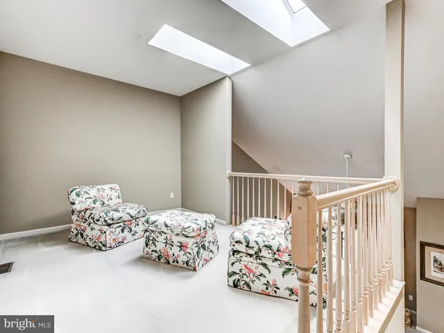 a bedroom with three beds and a baby crib