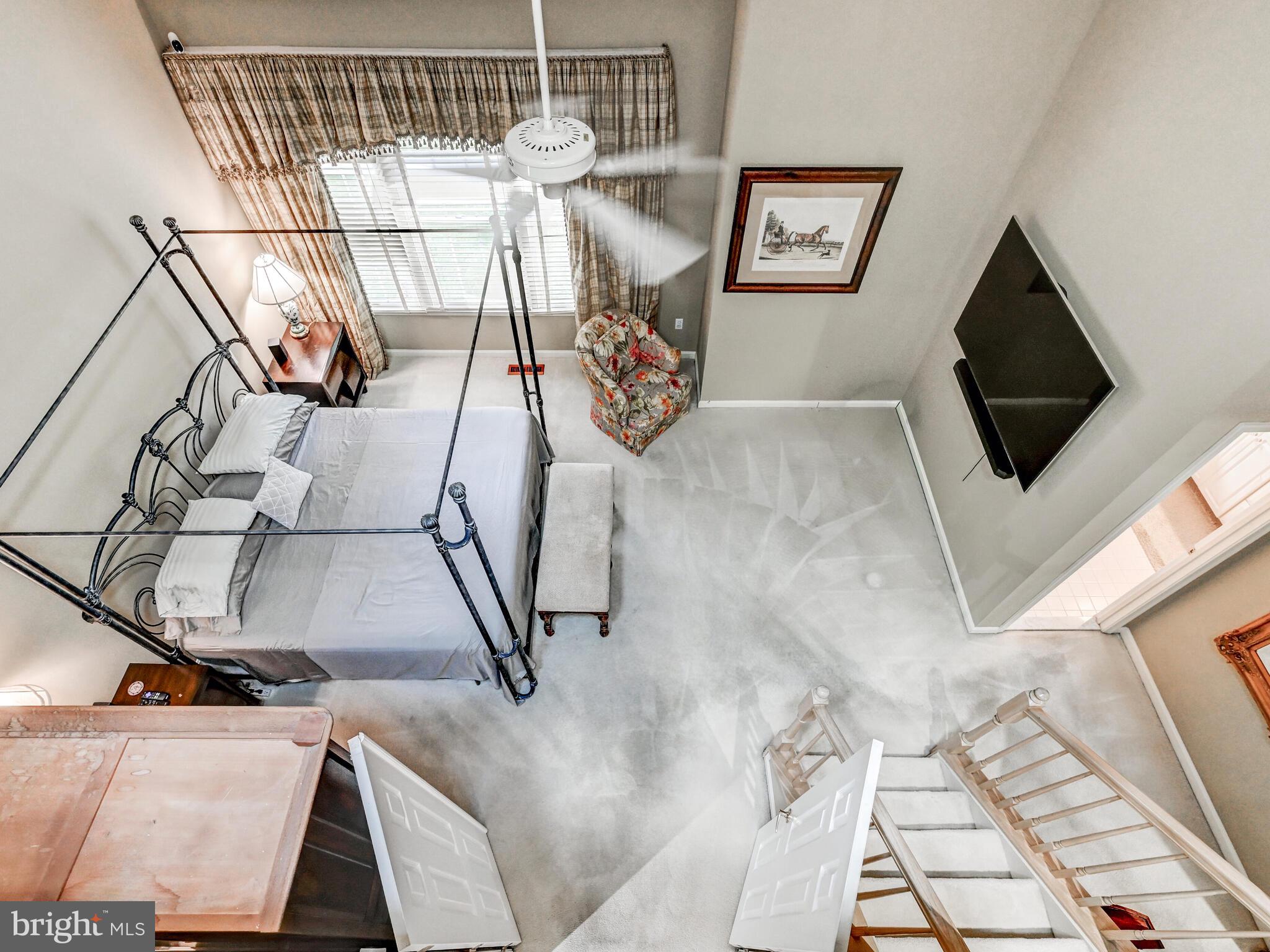 111 River Oaks Circle Baltimore, MD 21208 - Photo 25 of 35 a view of a livingroom with furniture and a flat screen tv