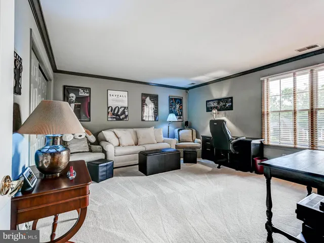 a bed room with furniture and a window