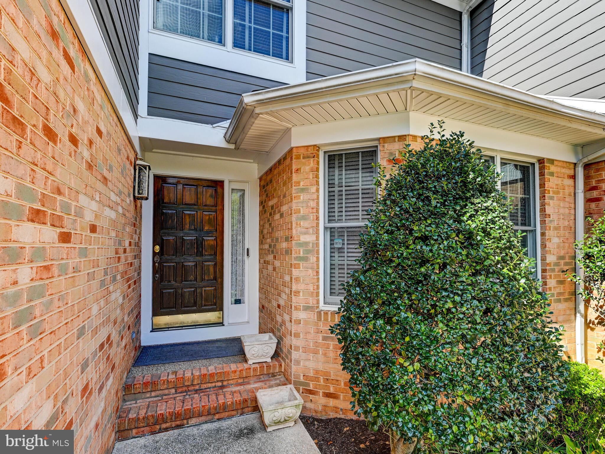 111 River Oaks Circle Baltimore, MD 21208 - Photo 3 of 35 a front view of a house with a garage