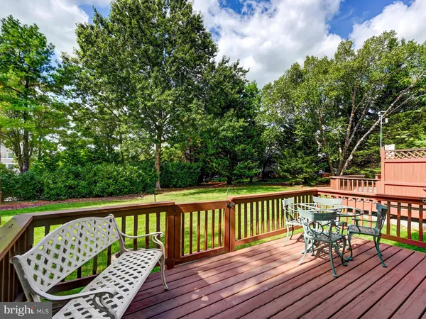 a view of a wooden deck with furniture