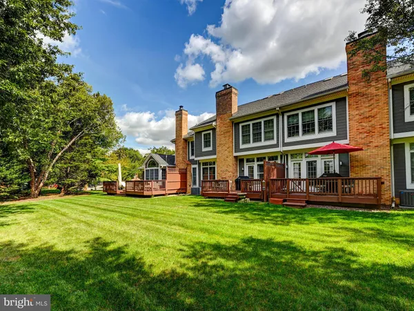 a view of a house with a yard porch and sitting area