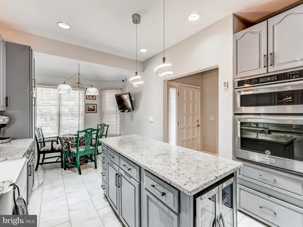 a kitchen with sink cabinets and stove