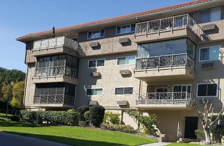 Very conveniently located in the golf course area with subterranean parking and an elevator that leads to the second floor end unit; the left end unit in this photo.