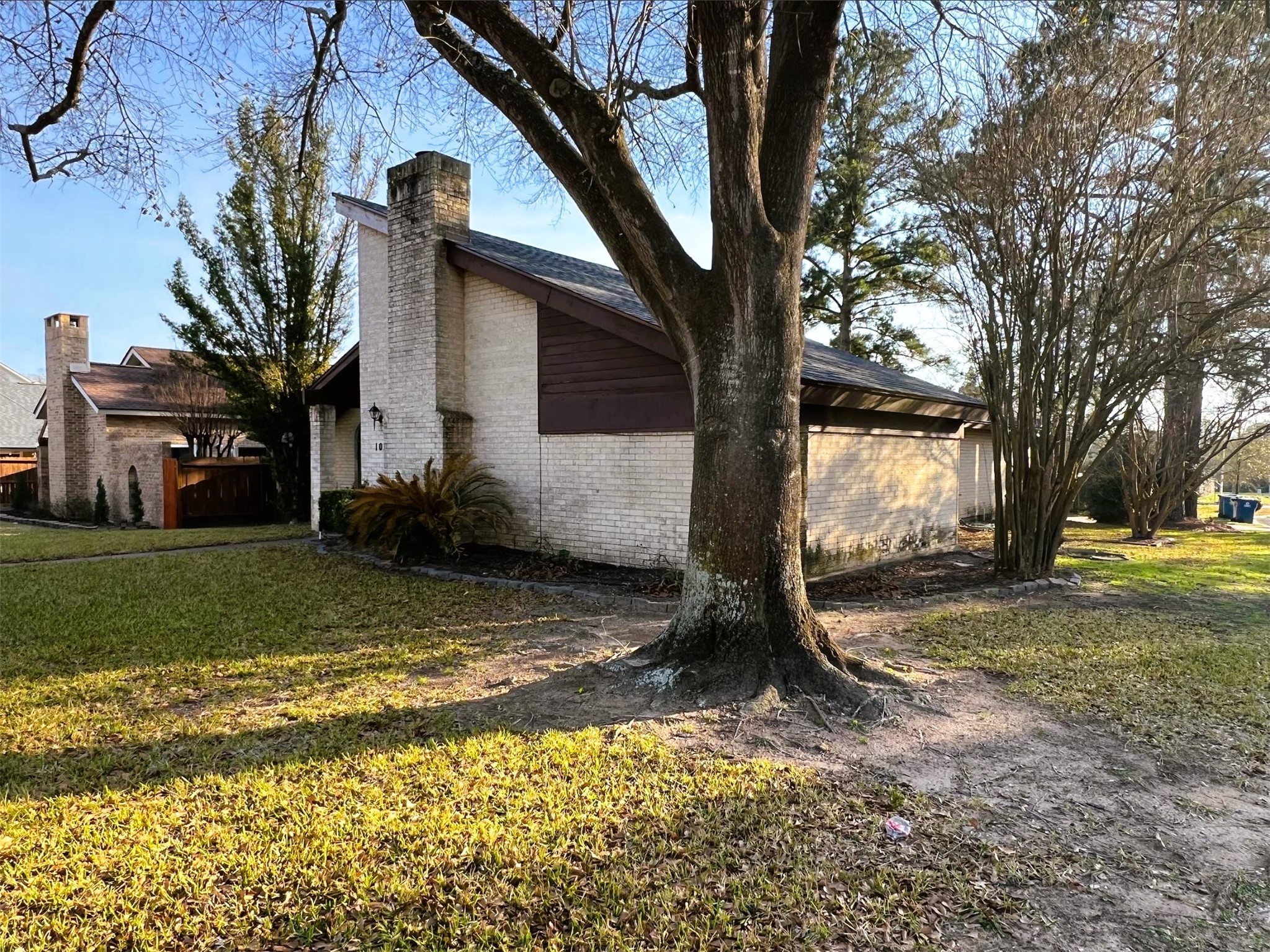 102 Briar Ridge Drive Bellville, TX 77418 - Photo 2 of 15 a view of a yard with a tree