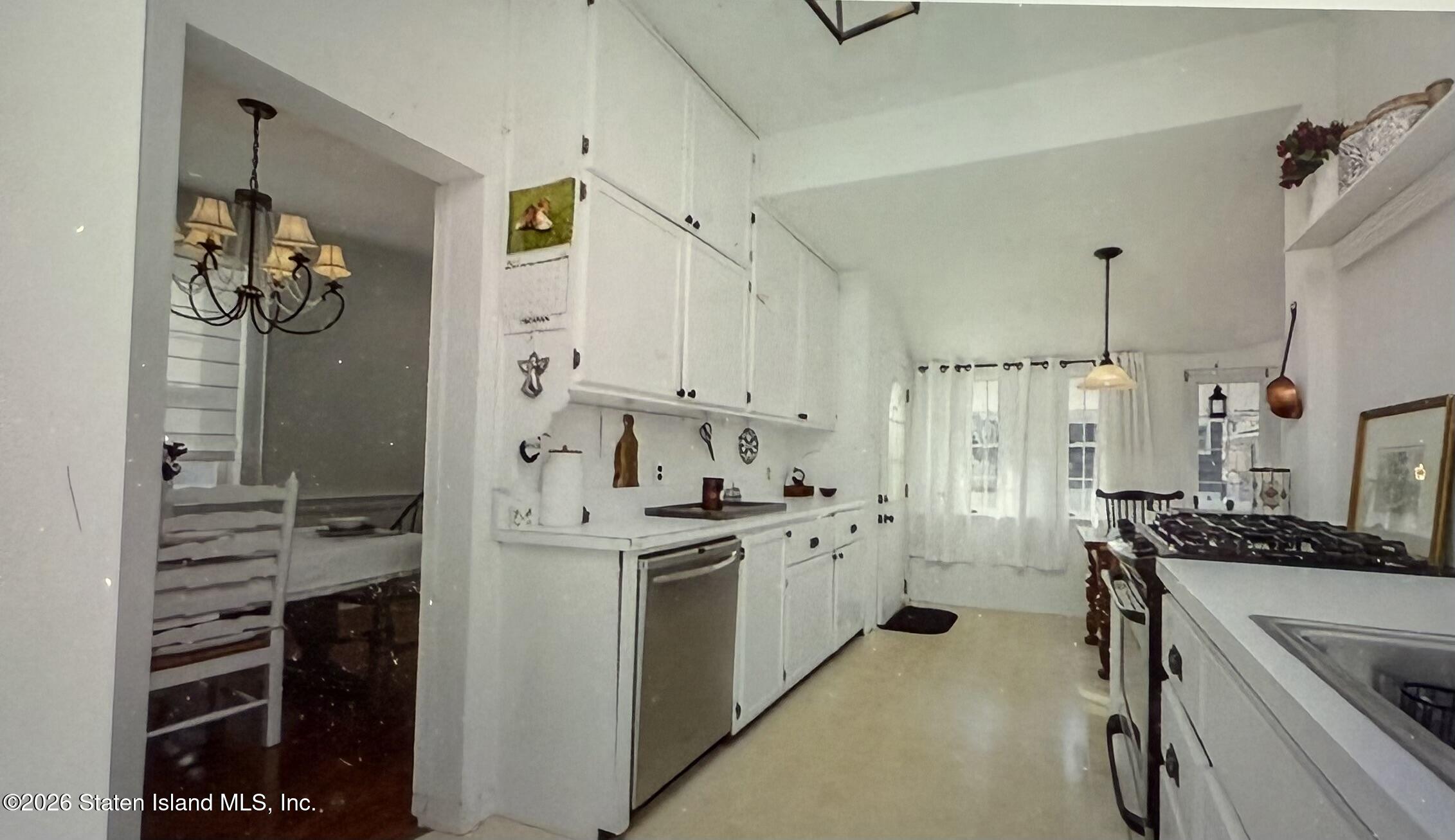 111 David Street Staten Island, NY 10308 - Photo 11 of 38 a kitchen with stainless steel appliances a stove a refrigerator and cabinets
