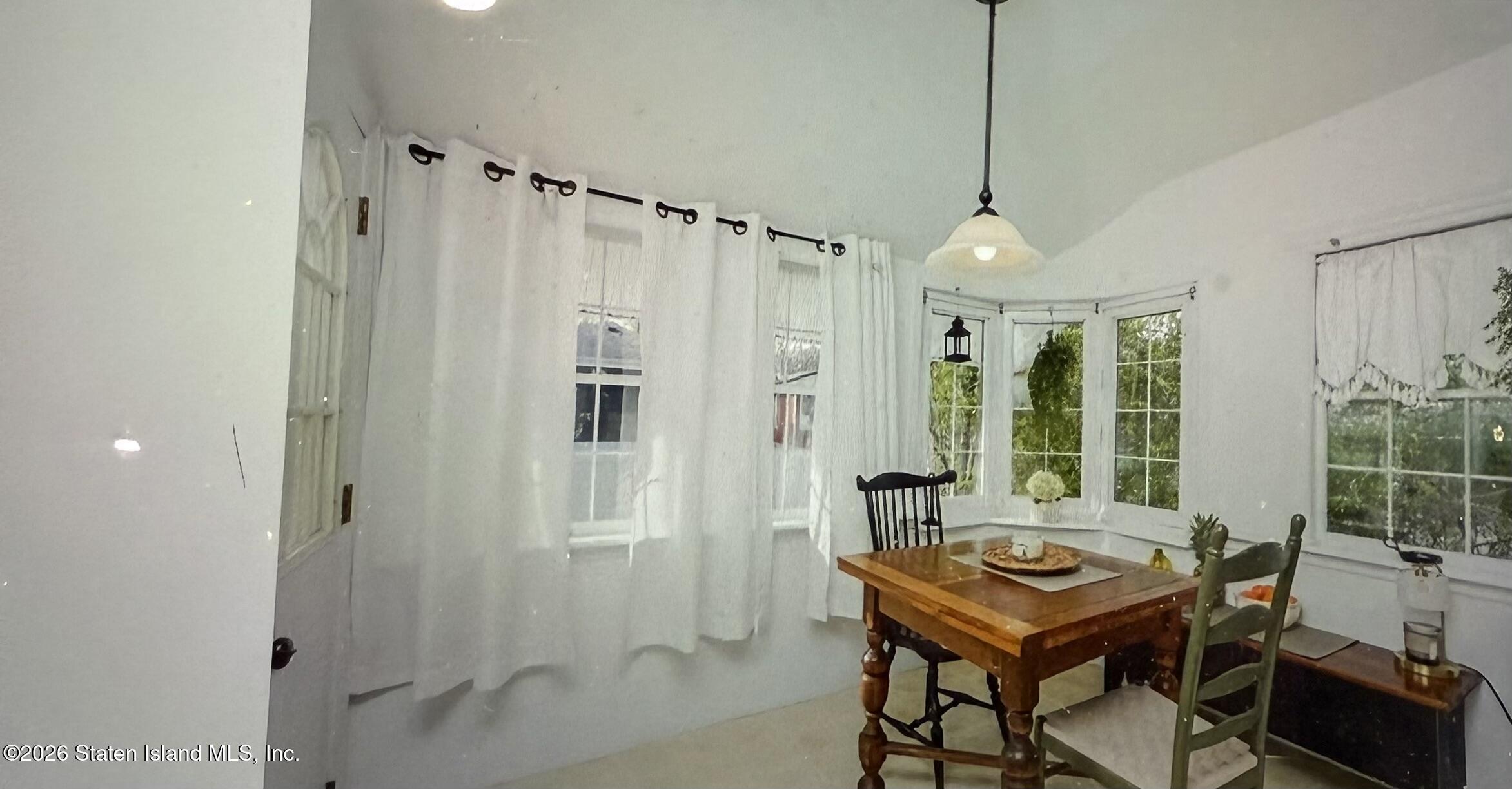 111 David Street Staten Island, NY 10308 - Photo 14 of 38 a room with a table and chairs