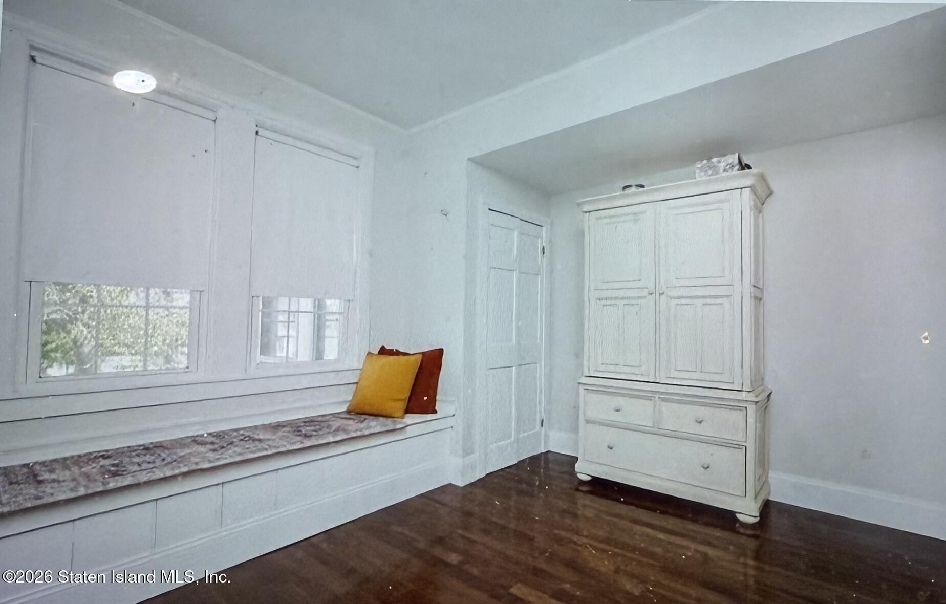 111 David Street Staten Island, NY 10308 - Photo 18 of 38 wooden floor in an empty room with a window