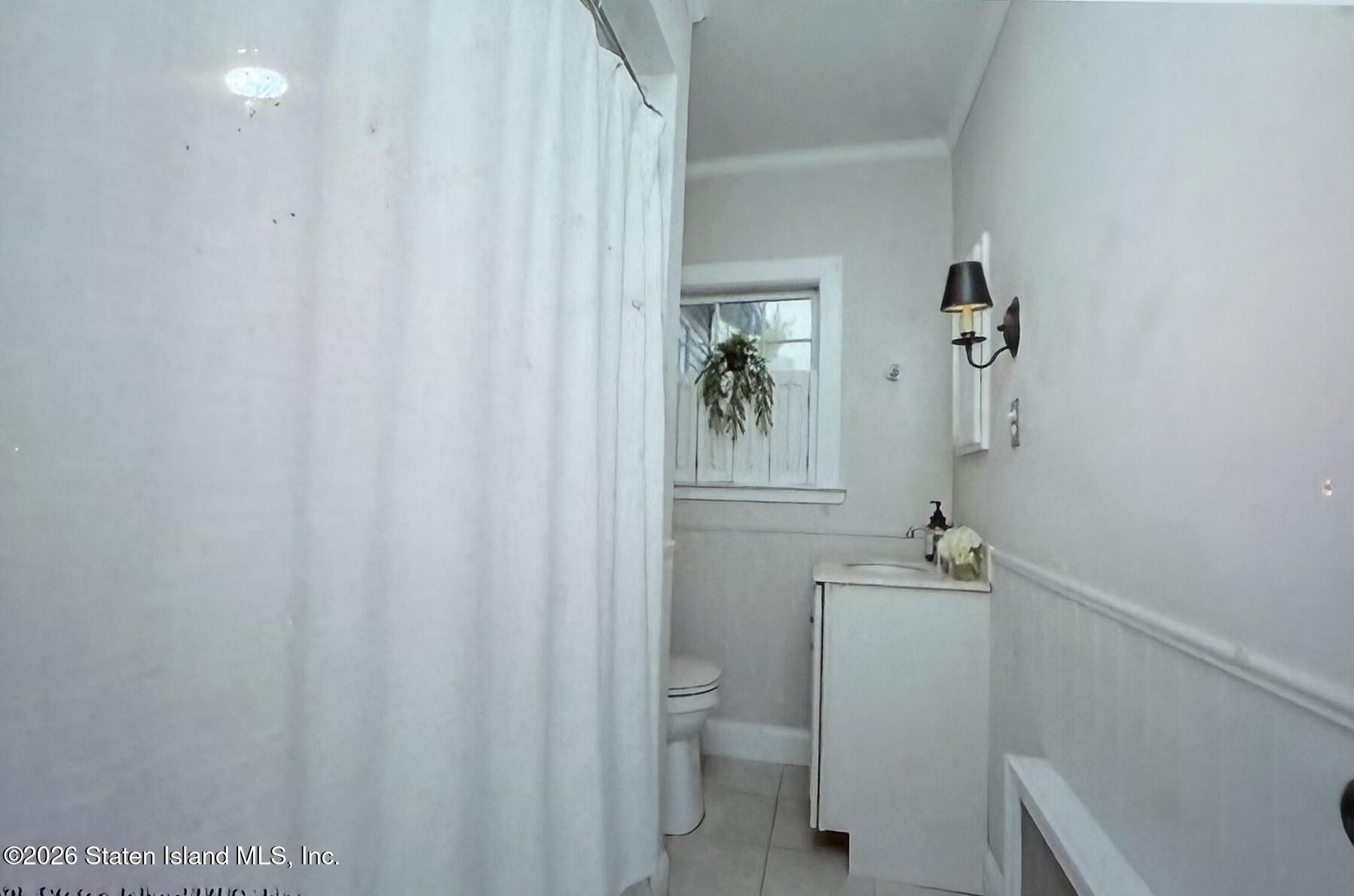 111 David Street Staten Island, NY 10308 - Photo 19 of 38 a bathroom with a sink a toilet and shower