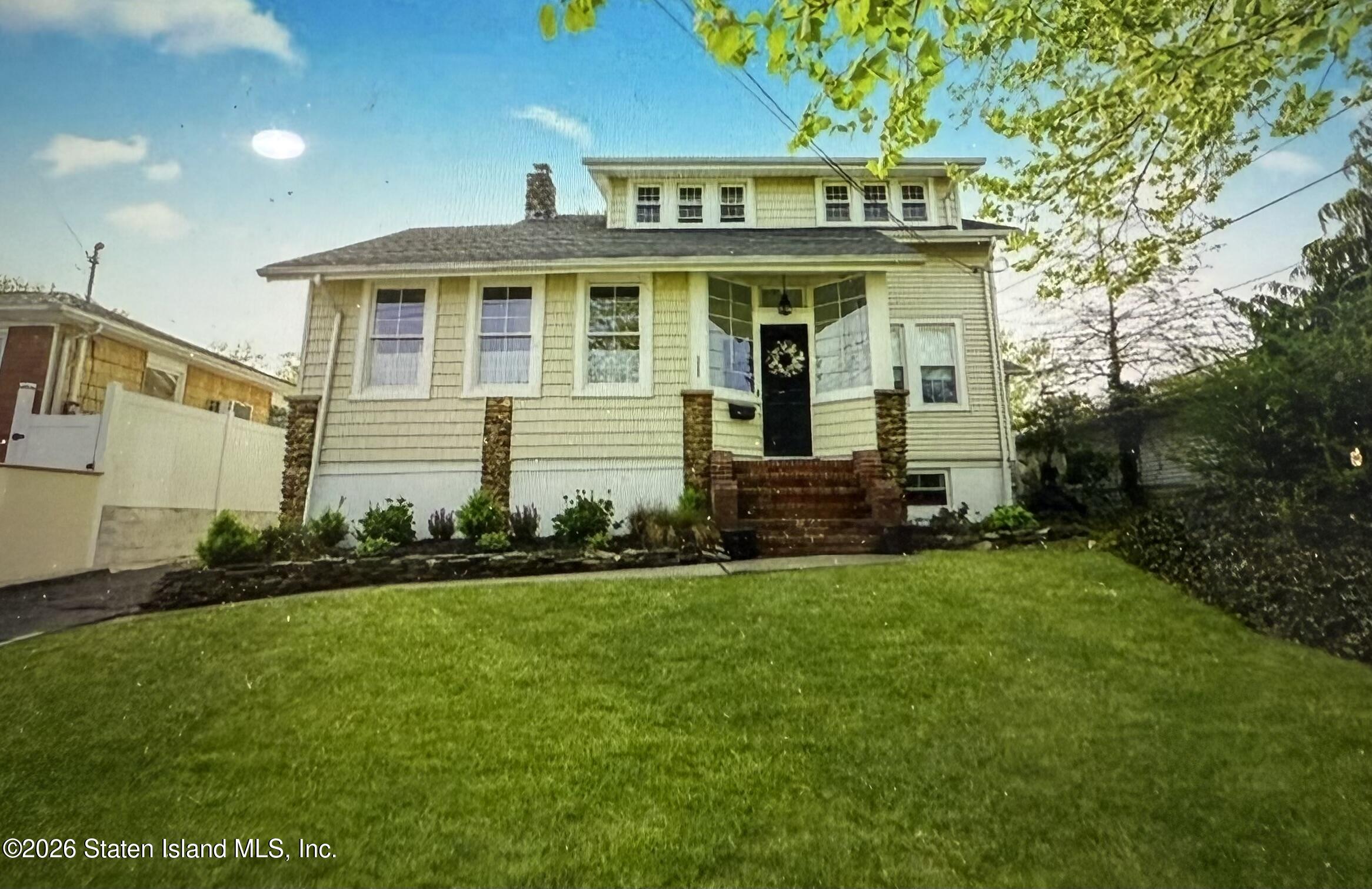 111 David Street Staten Island, NY 10308 - Photo 2 of 38 a front view of a house with a garden