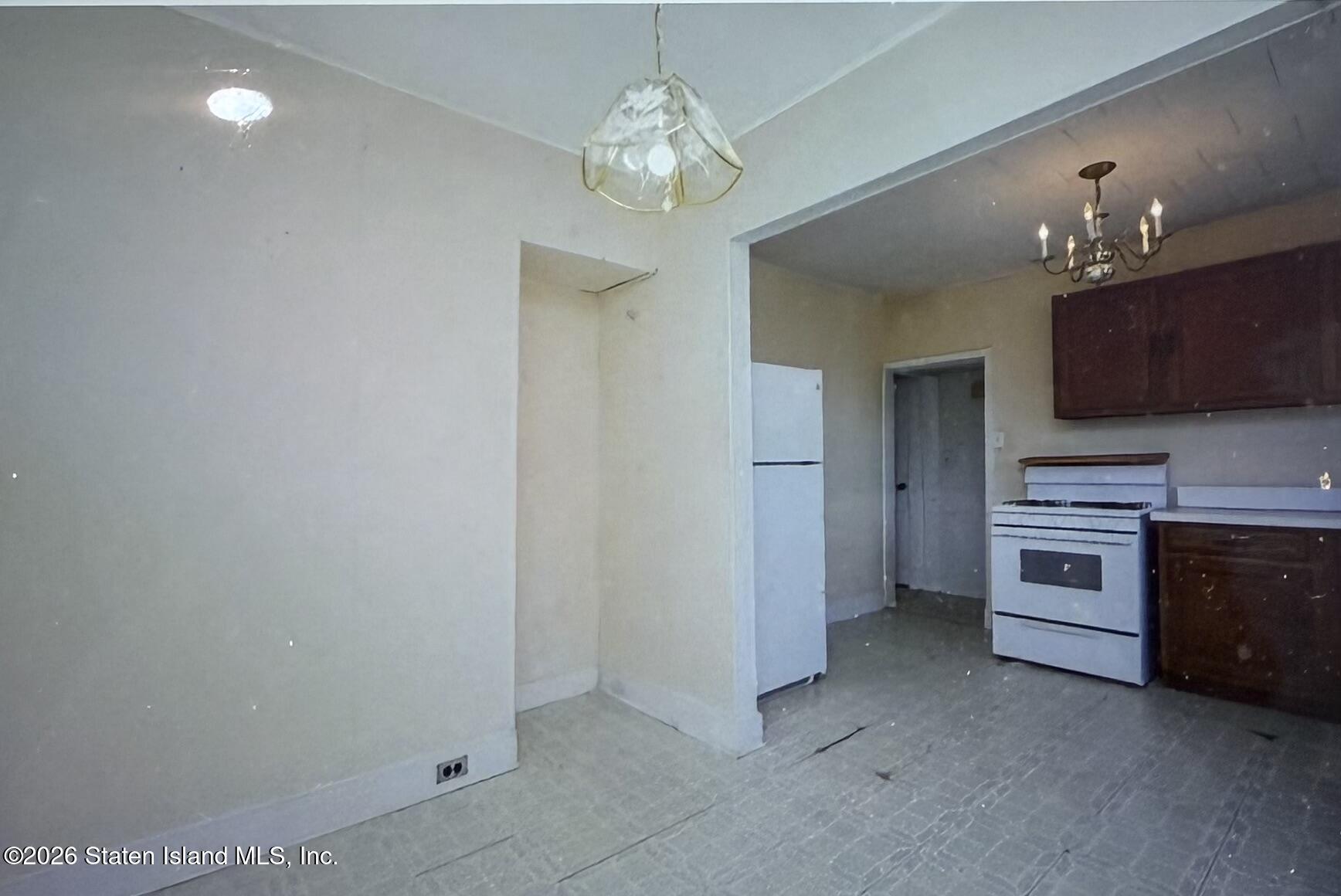 111 David Street Staten Island, NY 10308 - Photo 22 of 38 a view of a kitchen with a sink and a stove top oven