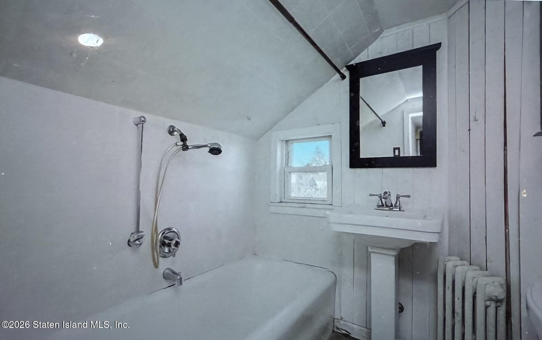 111 David Street Staten Island, NY 10308 - Photo 27 of 38 a bathroom with a tub sink and mirror