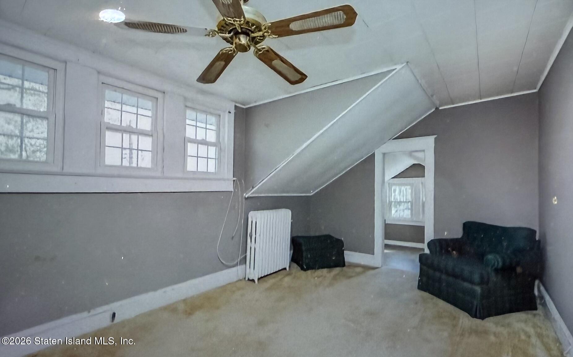 111 David Street Staten Island, NY 10308 - Photo 30 of 38 a living room with furniture and a ceiling fan