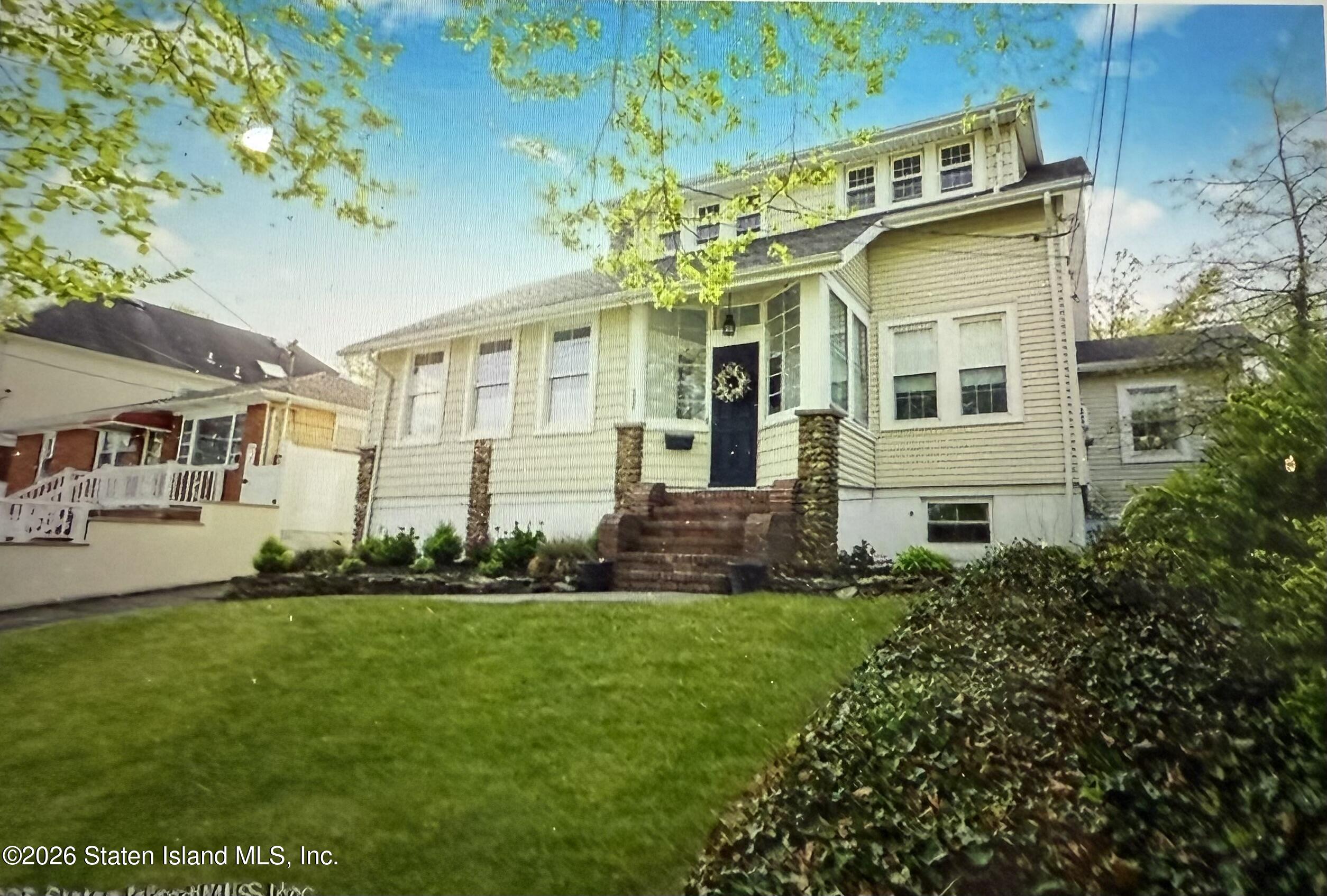 111 David Street Staten Island, NY 10308 - Photo 3 of 38 a front view of a house with a yard