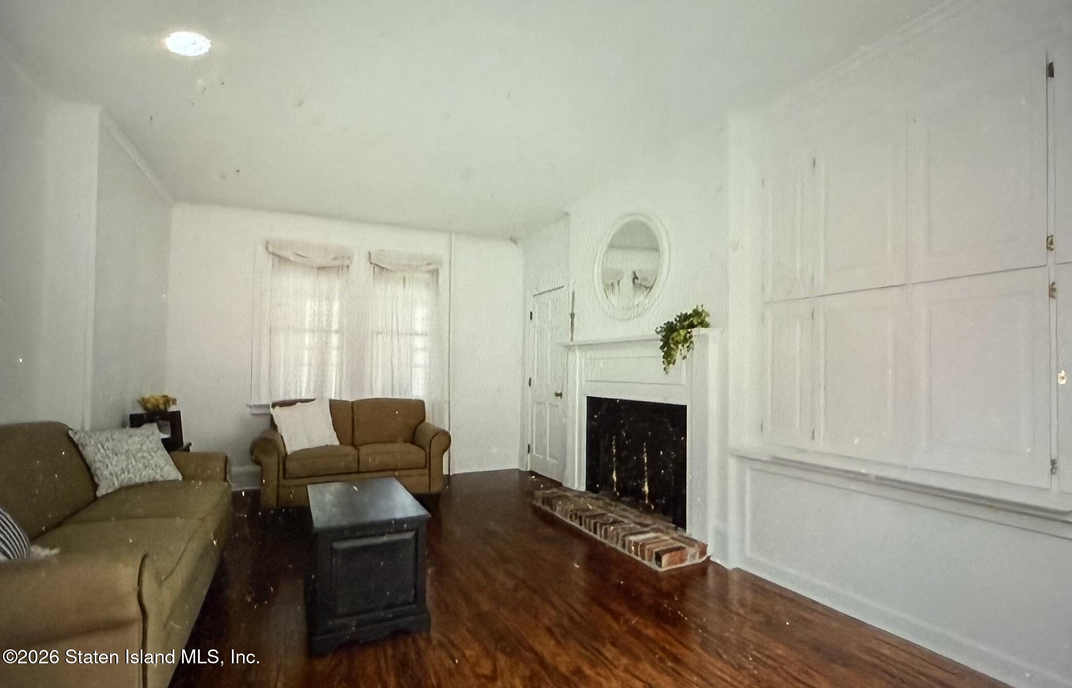 111 David Street Staten Island, NY 10308 - Photo 8 of 38 a living room with furniture and a fireplace