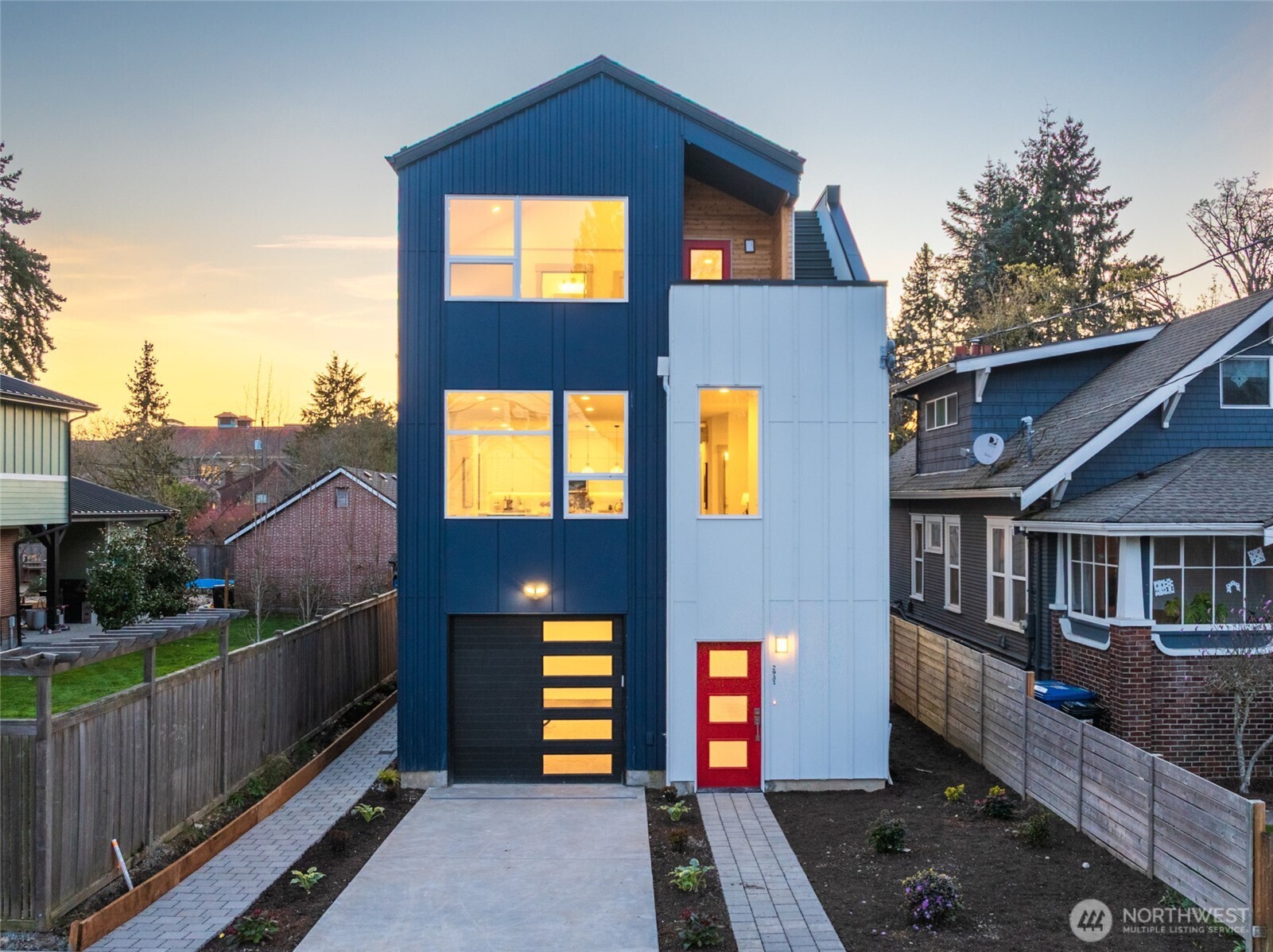 2931 39th Avenue Southwest Seattle, WA 98116 - Photo 1 of 40 a front view of a house with a yard