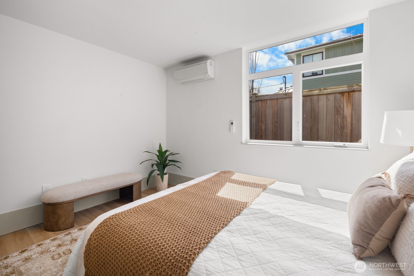 2931 39th Avenue Southwest Seattle, WA 98116 - Photo 27 of 40 a bedroom with a bed and a window