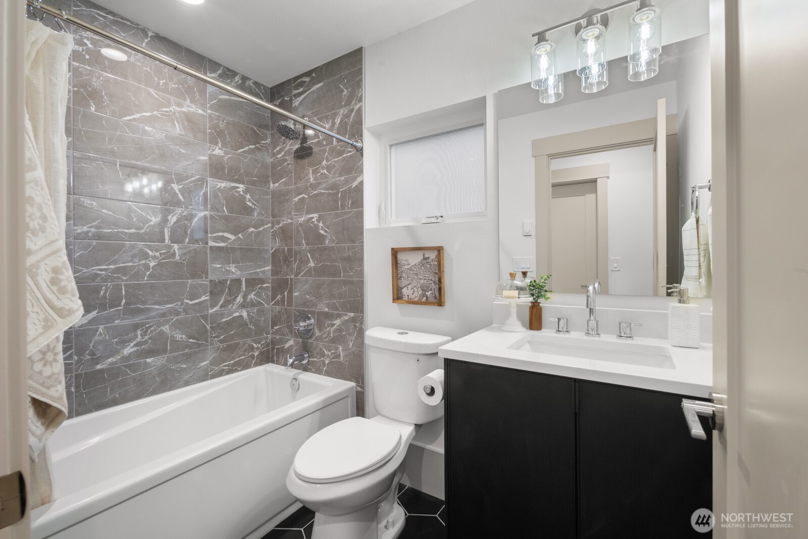 2931 39th Avenue Southwest Seattle, WA 98116 - Photo 29 of 40 a bathroom with a sink a toilet and shower