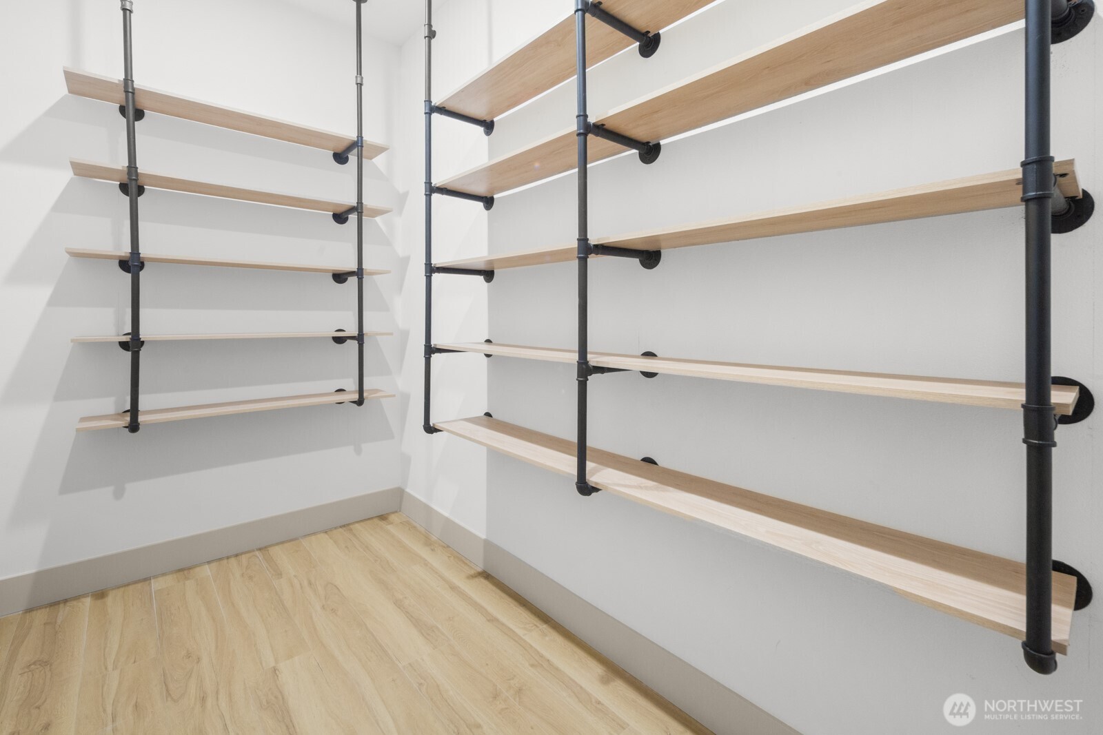 2931 39th Avenue Southwest Seattle, WA 98116 - Photo 9 of 40 a view of an empty room with empty racks