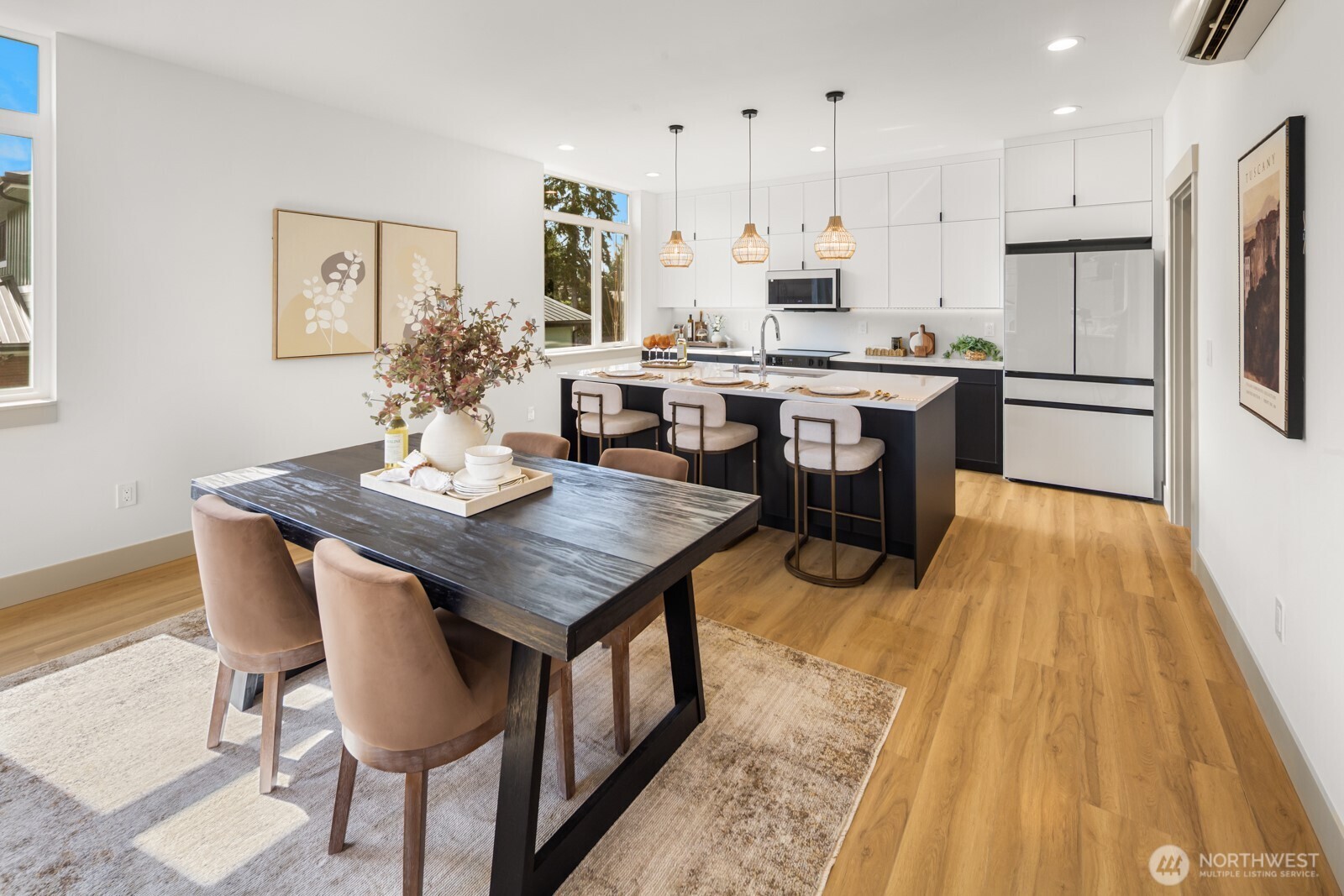 2931 39th Avenue Southwest Seattle, WA 98116 - Photo 10 of 40 a kitchen with a table chairs refrigerator and cabinets