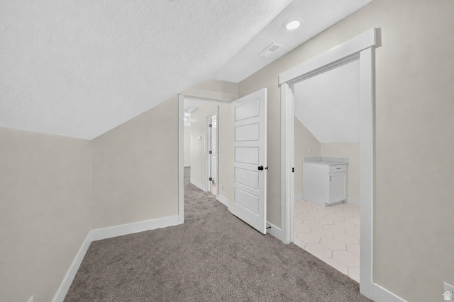 1002 West Temple Rim Lane Payson, UT 84651 - Photo 40 of 68 Carpeted hallway featuring an angled ceiling and recessed lighting