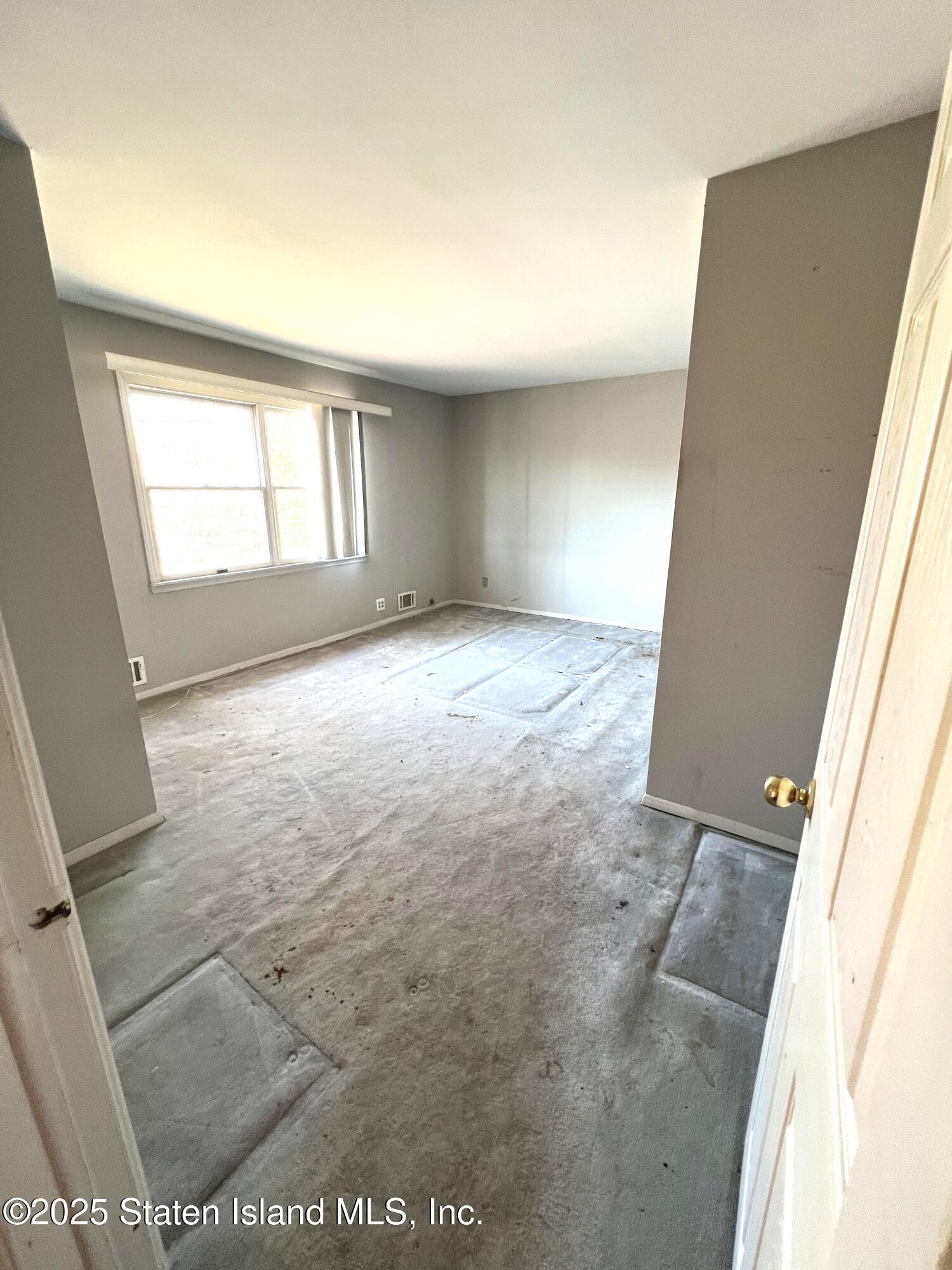85 Foster Road Staten Island, NY 10309 - Photo 19 of 34 an empty room with windows