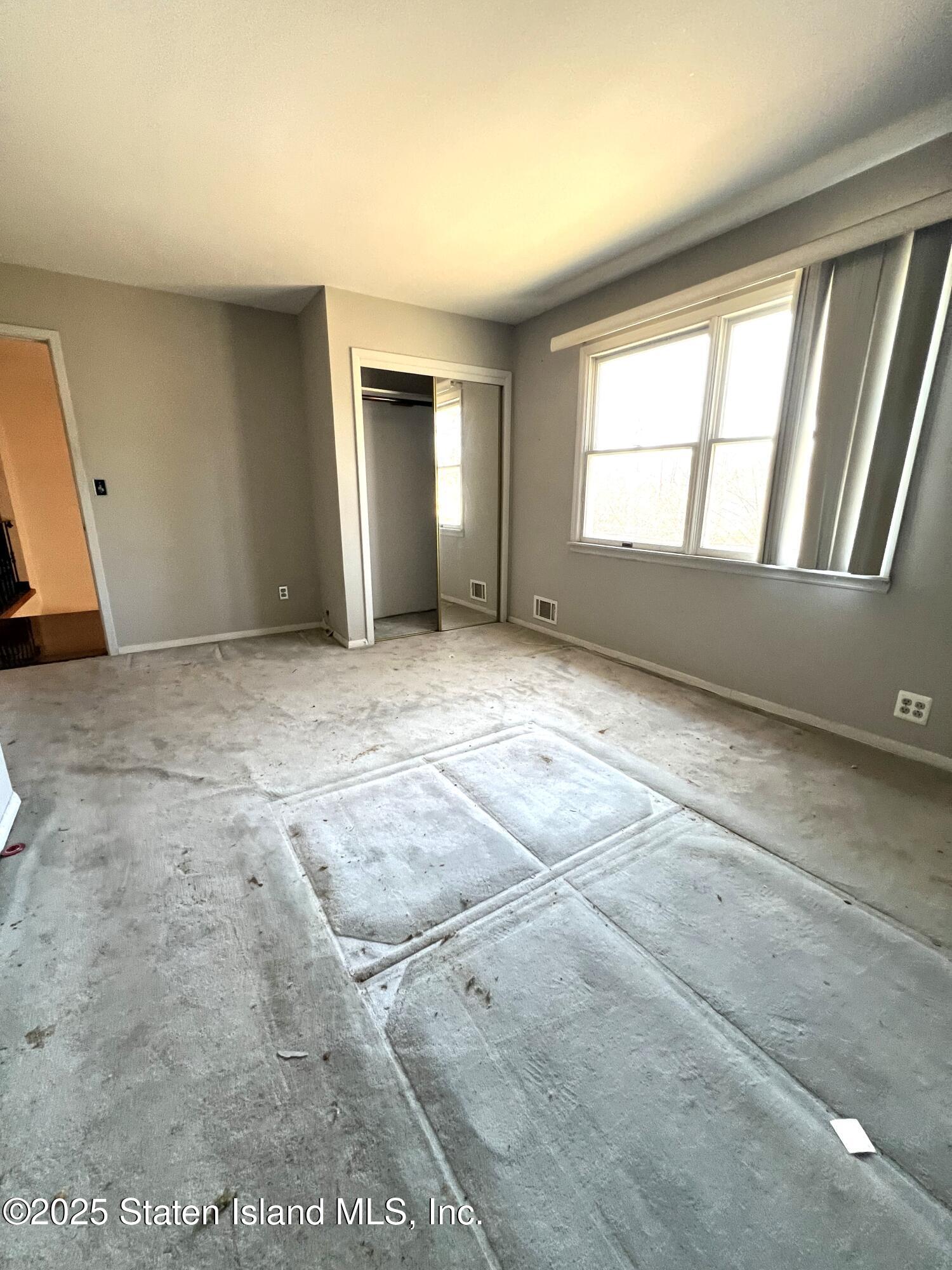 85 Foster Road Staten Island, NY 10309 - Photo 20 of 34 an empty room with windows