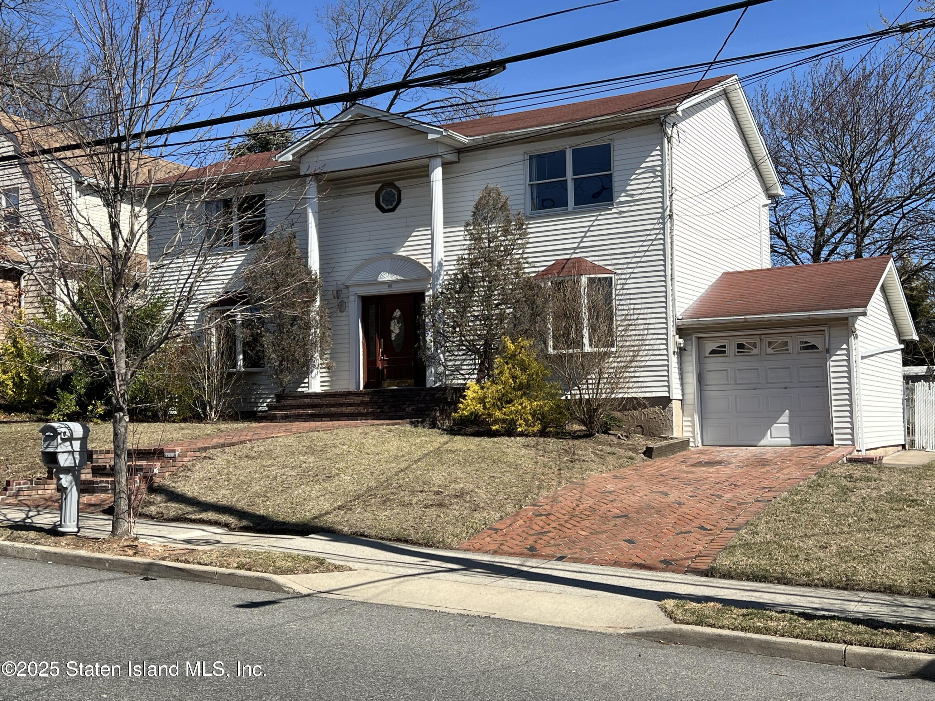 85 Foster Road Staten Island, NY 10309 - Photo 2 of 34 a view of a house with a patio