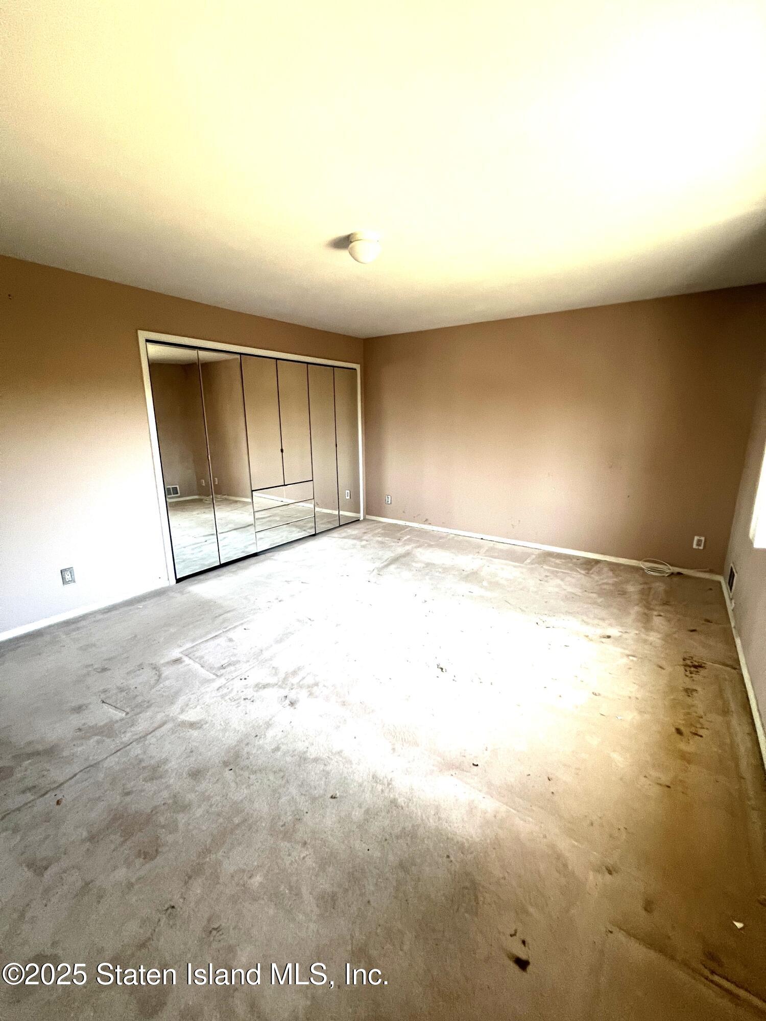 85 Foster Road Staten Island, NY 10309 - Photo 22 of 34 an empty room with an empty space