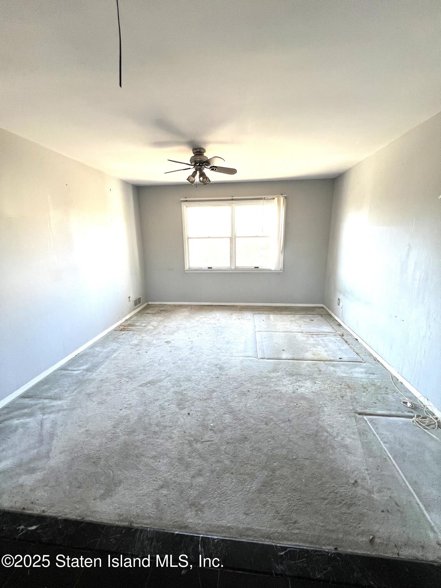 85 Foster Road Staten Island, NY 10309 - Photo 26 of 34 an empty room with windows