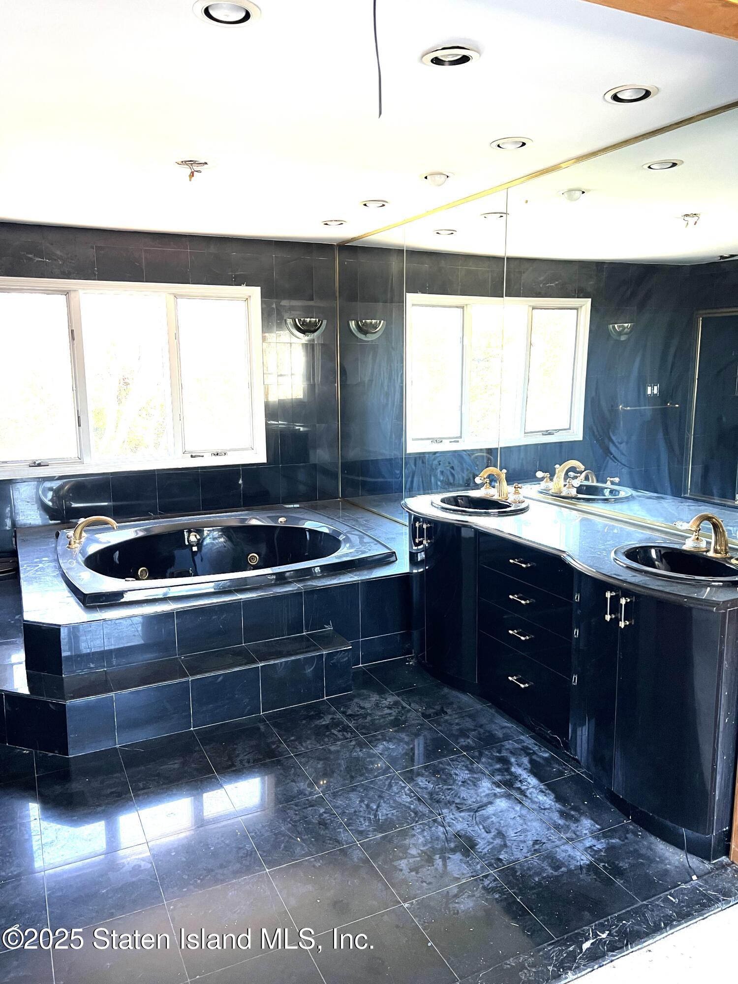 85 Foster Road Staten Island, NY 10309 - Photo 29 of 34 a kitchen with a sink and a stove