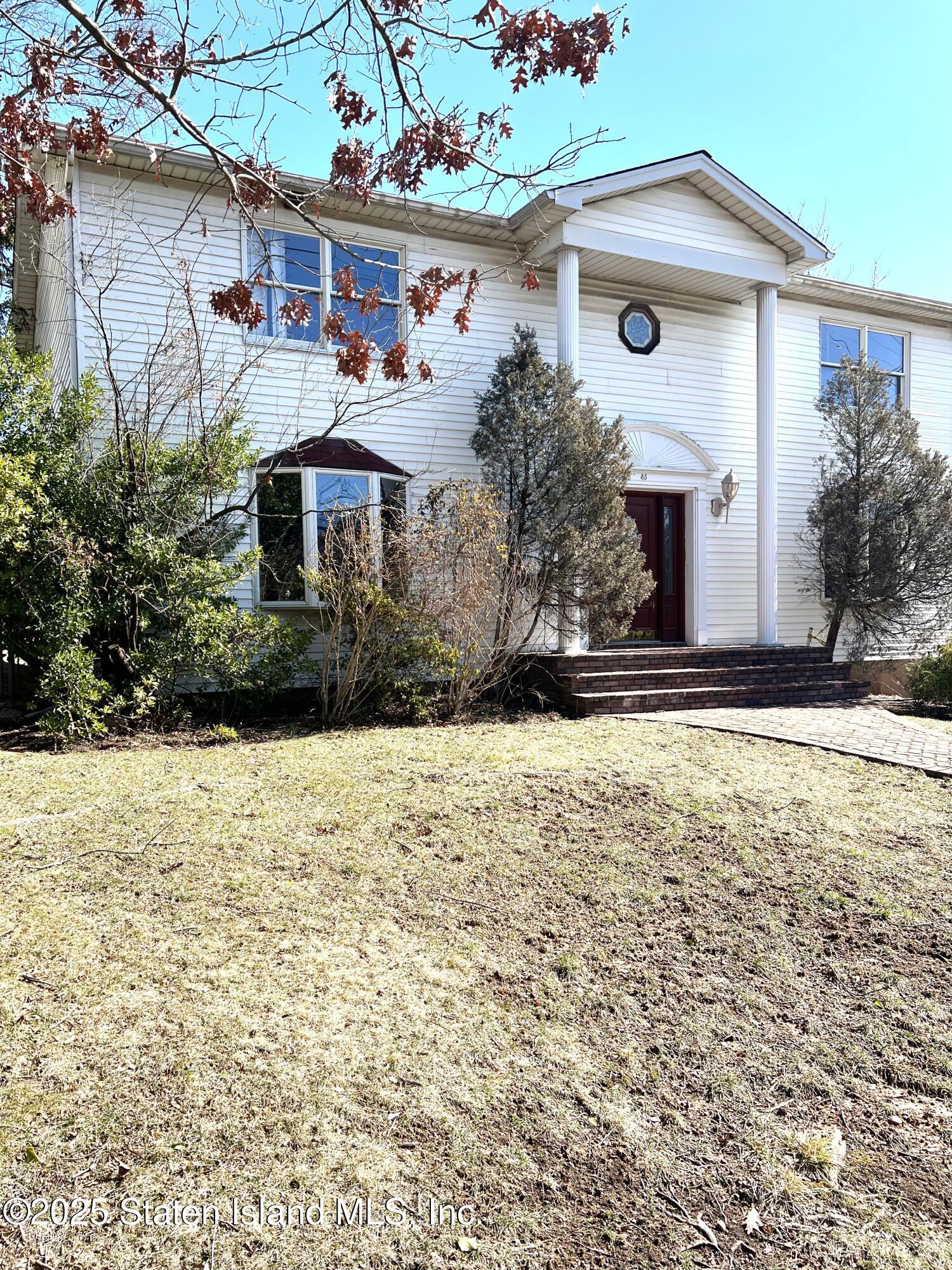 85 Foster Road Staten Island, NY 10309 - Photo 3 of 34 a front view of house with yard