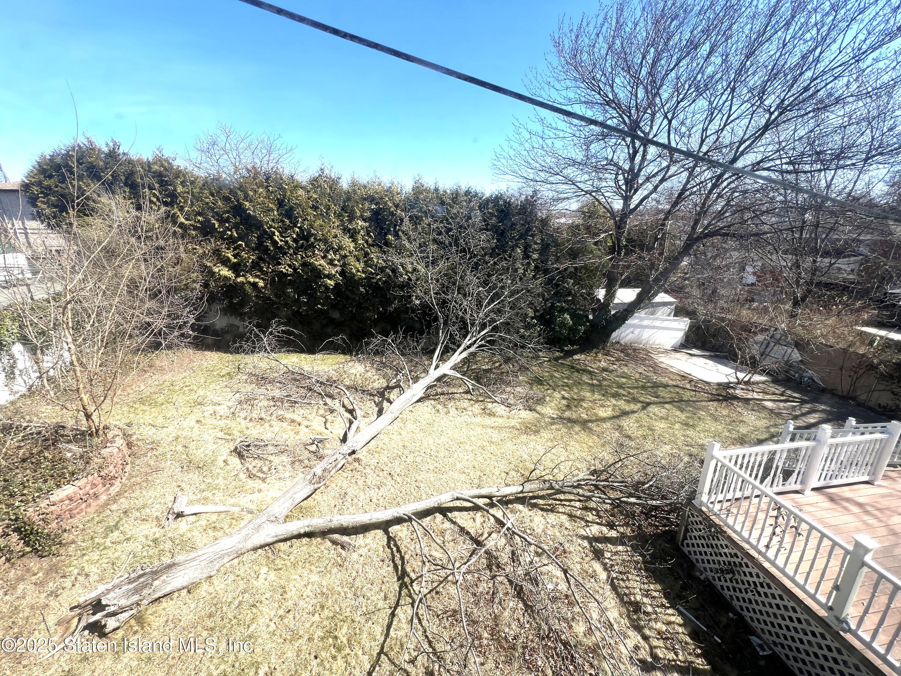 85 Foster Road Staten Island, NY 10309 - Photo 32 of 34 a view of a yard with wooden fence