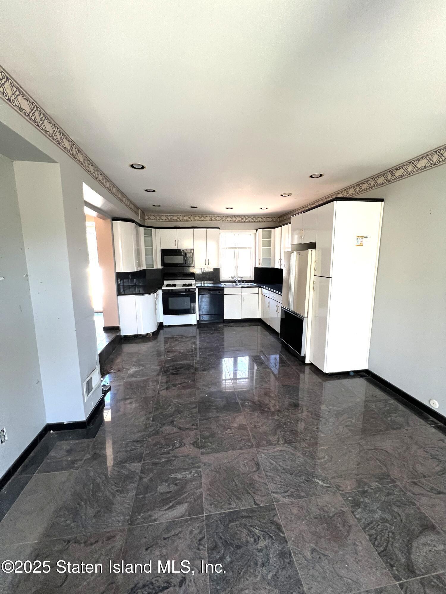 85 Foster Road Staten Island, NY 10309 - Photo 9 of 34 a view of kitchen with furniture and refrigerator