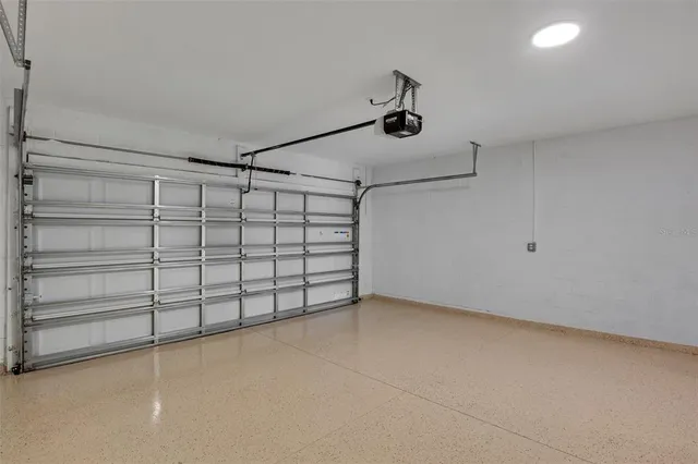 a view of a backyard with a fountain and palm trees