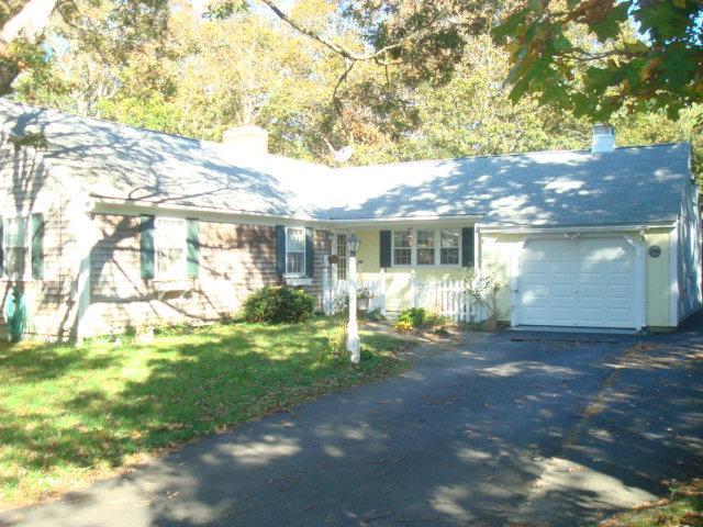 208 Bumps River Road Osterville, MA 02655 - Photo 2 of 16 a backyard of a house with table and chairs