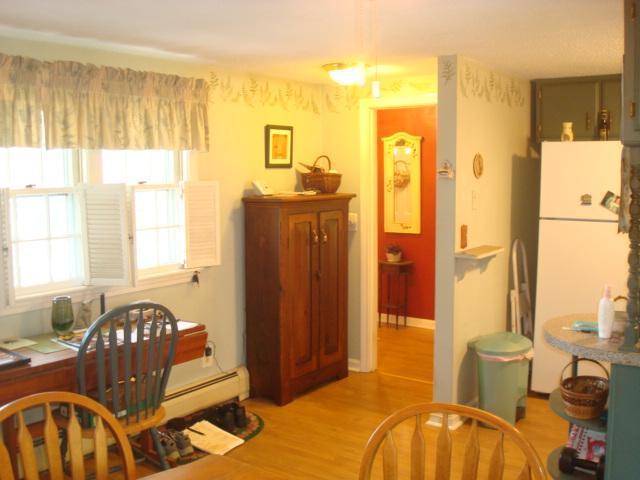 208 Bumps River Road Osterville, MA 02655 - Photo 6 of 16 a bedroom with a bed and wooden floor