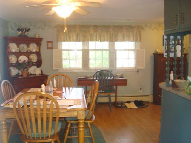 208 Bumps River Road Osterville, MA 02655 - Photo 7 of 16 a view of a dining room with furniture window and outside view