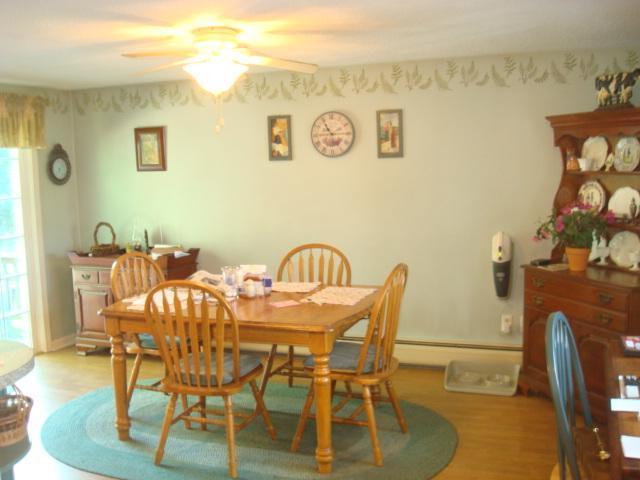 208 Bumps River Road Osterville, MA 02655 - Photo 8 of 16 a view of a dining room with furniture