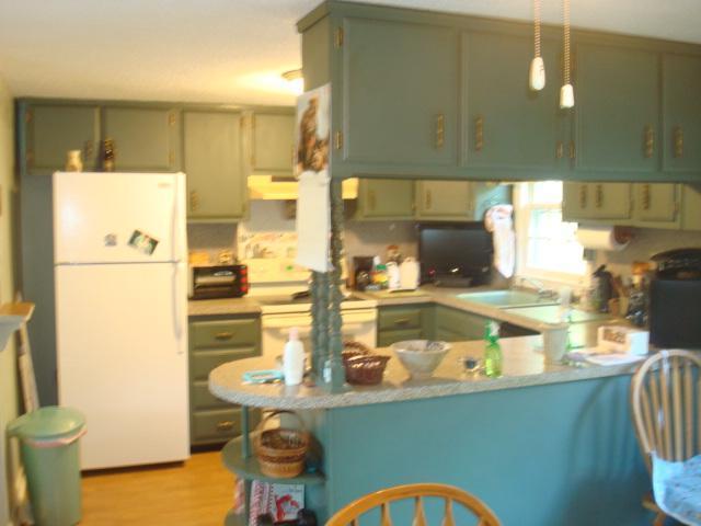 208 Bumps River Road Osterville, MA 02655 - Photo 9 of 16 a kitchen with stainless steel appliances granite countertop a sink and a refrigerator