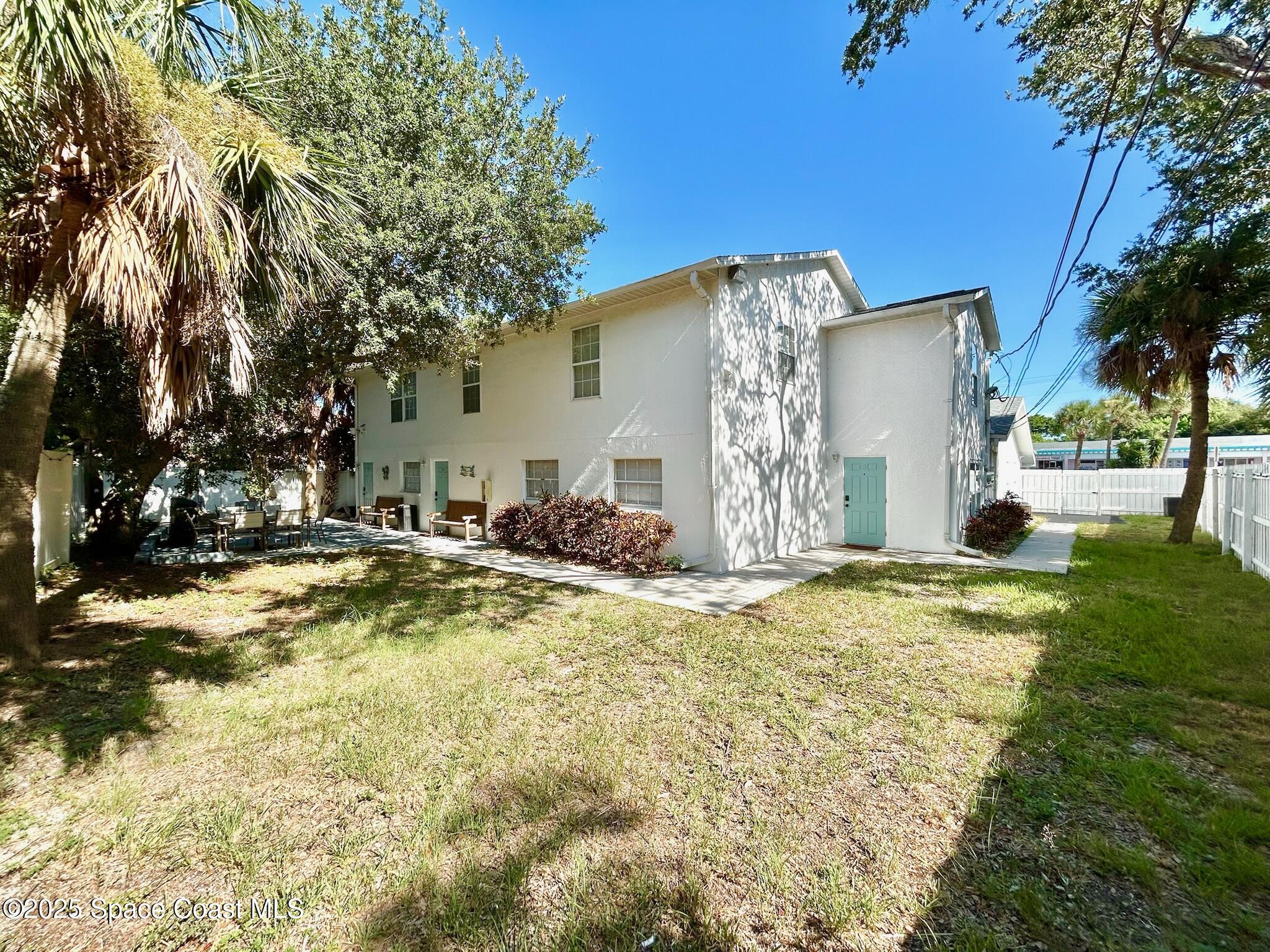 8110 Canaveral Boulevard, Unit 3 Cape Canaveral, FL 32920 - Photo 8 of 25 a view of a house with snow on the ground