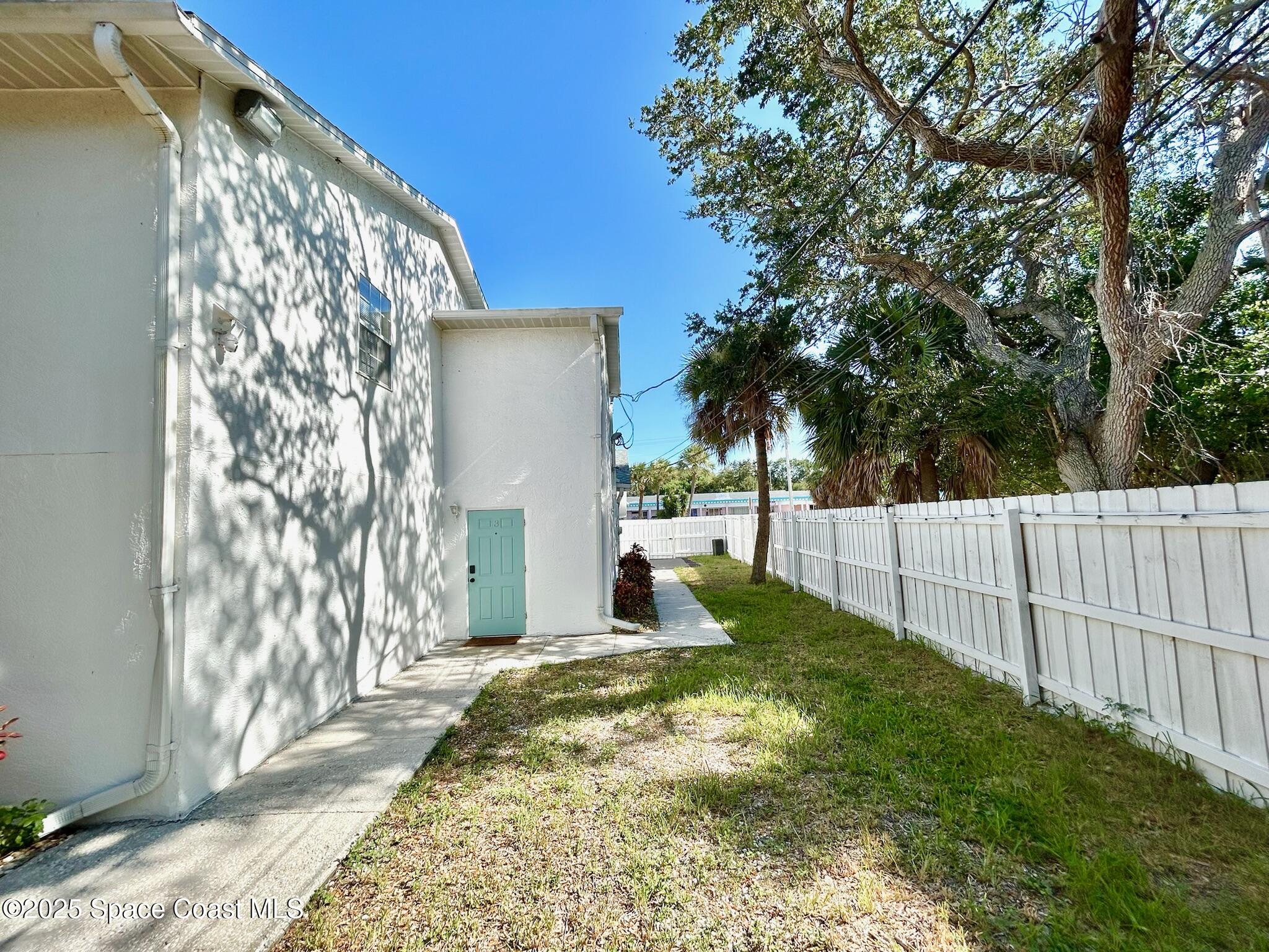 8110 Canaveral Boulevard, Unit 3 Cape Canaveral, FL 32920 - Photo 9 of 25 a house view with garden space